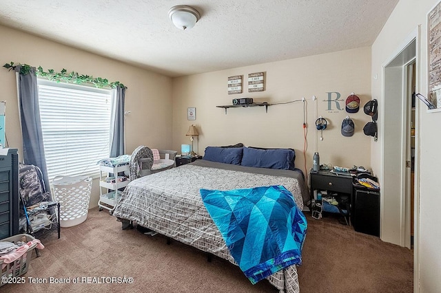 420 Roberts St, Thayne, WY 83127 - carpeted bedroom featuring a textured ceiling