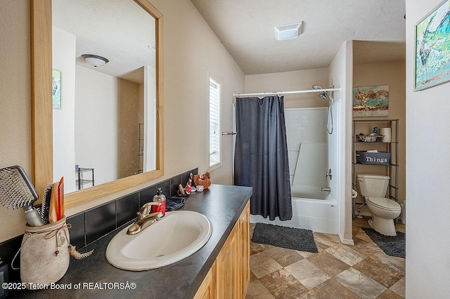 420 Roberts St, Thayne, WY 83127 - full bathroom featuring toilet, vanity, and shower / bathtub combination with curtain