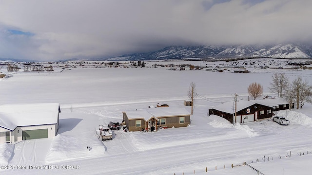 420 Roberts St, Thayne, WY 83127 - snowy aerial view featuring a mountain view