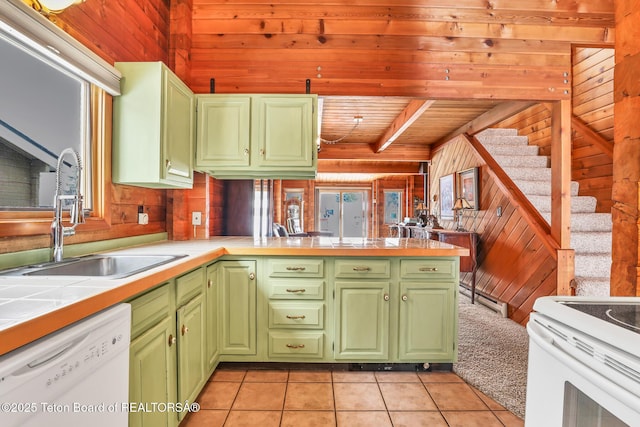 kitchen with tile countertops, wood walls, sink, kitchen peninsula, and white appliances