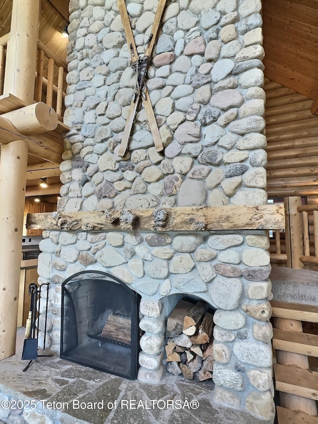 6352 W 1170 N, Driggs, ID 83442 - detailed view of log walls and a stone fireplace