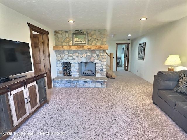 6352 W 1170 N, Driggs, ID 83442 - carpeted living room with a stone fireplace and recessed lighting