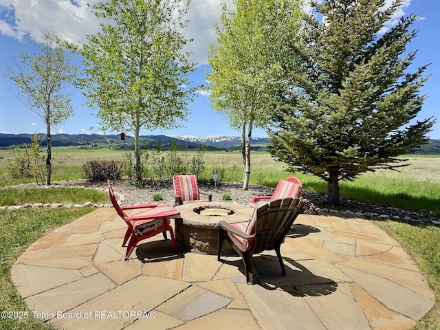 6352 W 1170 N, Driggs, ID 83442 - view of patio featuring an outdoor fire pit and a mountain view
