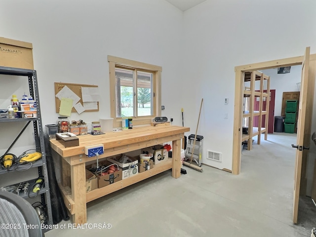 6352 W 1170 N, Driggs, ID 83442 - office space with a workshop area, concrete flooring, and a high ceiling