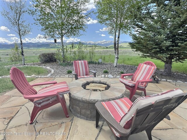 6352 W 1170 N, Driggs, ID 83442 - view of patio / terrace with an outdoor fire pit and a mountain view