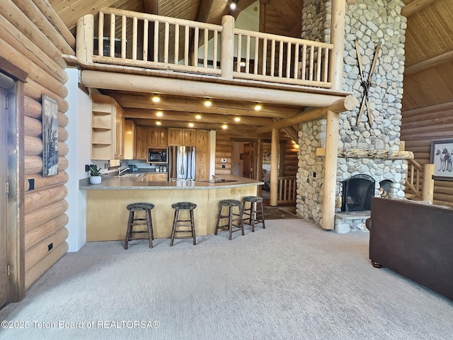 6352 W 1170 N, Driggs, ID 83442 - kitchen featuring black microwave, freestanding refrigerator, high vaulted ceiling, log walls, and open shelves