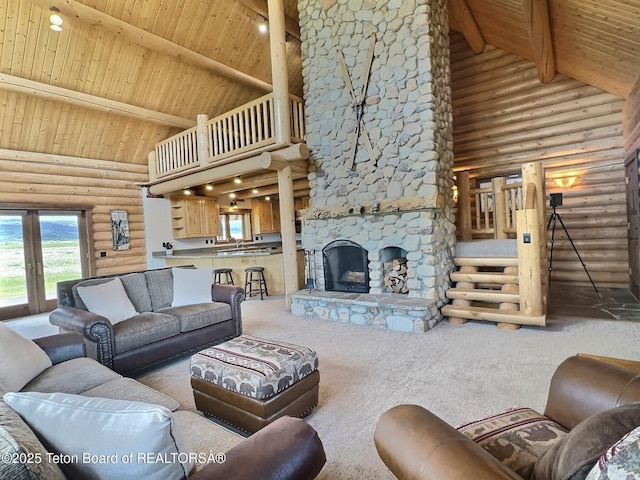 6352 W 1170 N, Driggs, ID 83442 - carpeted living area with high vaulted ceiling, rustic walls, wood ceiling with exposed beams, and a stone fireplace