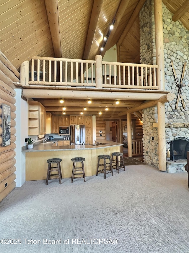 6352 W 1170 N, Driggs, ID 83442 - kitchen with high vaulted ceiling, freestanding refrigerator, open shelves, carpet flooring, and wood ceiling with exposed beams