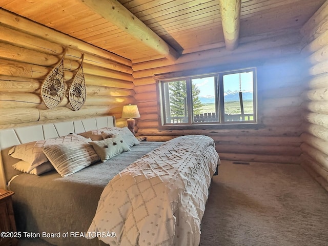 6352 W 1170 N, Driggs, ID 83442 - bedroom with log walls, wood ceiling with exposed beams, and carpet floors
