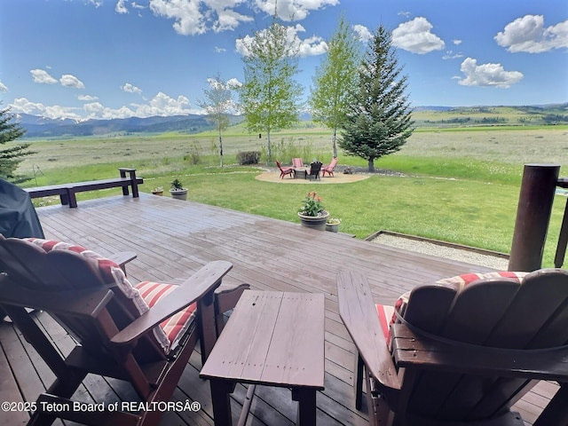6352 W 1170 N, Driggs, ID 83442 - wooden deck featuring a view of rural / pastoral area, a yard, and outdoor dining space
