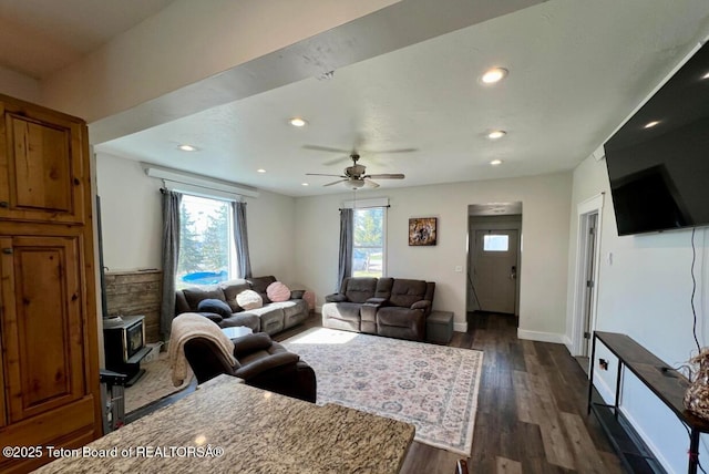 living room with dark hardwood / wood-style floors and ceiling fan