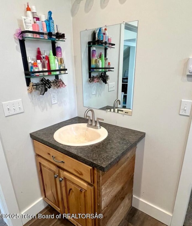 bathroom featuring vanity and wood-type flooring