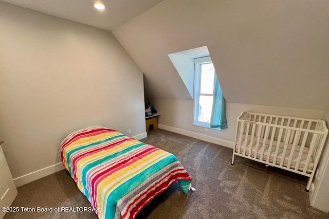 carpeted bedroom featuring lofted ceiling