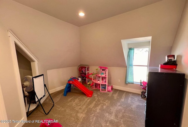 recreation room featuring lofted ceiling and carpet flooring