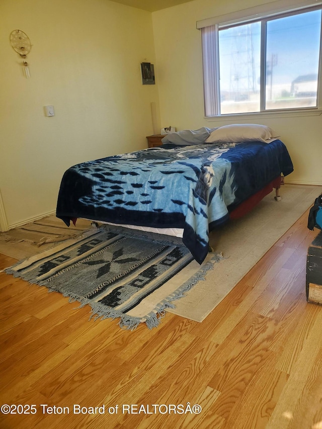 bedroom featuring hardwood / wood-style floors