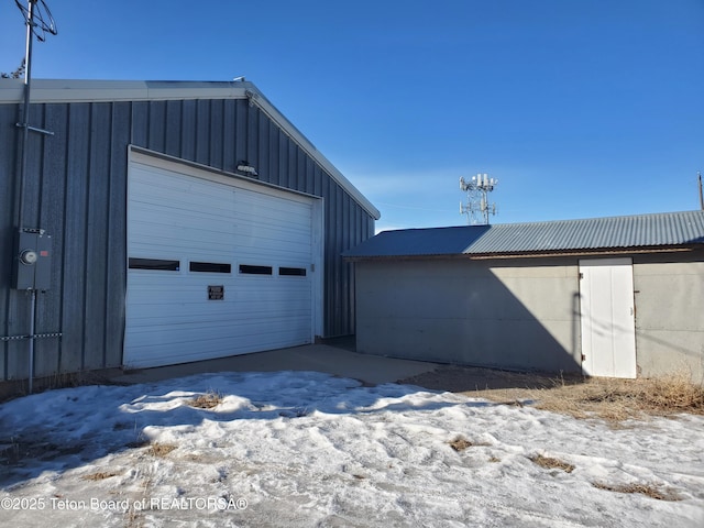 view of snow covered garage