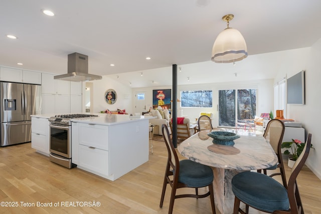 725 Cache Creek Dr, Jackson, WY 83001 - kitchen featuring pendant lighting, island range hood, white cabinetry, and appliances with stainless steel finishes