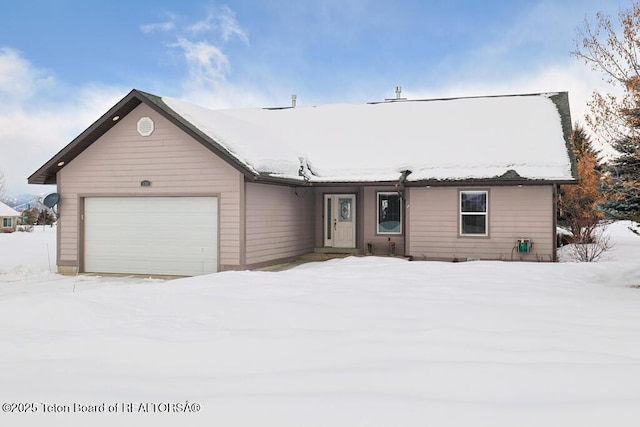 single story home featuring a garage