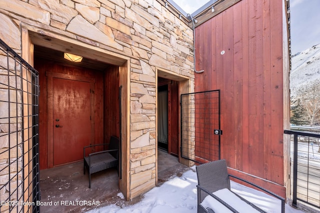 view of snow covered property entrance