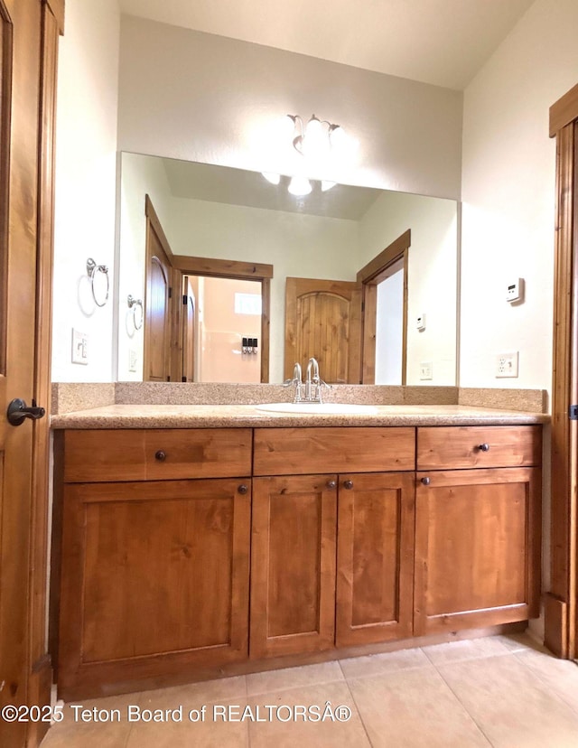 bathroom with vanity and tile patterned flooring