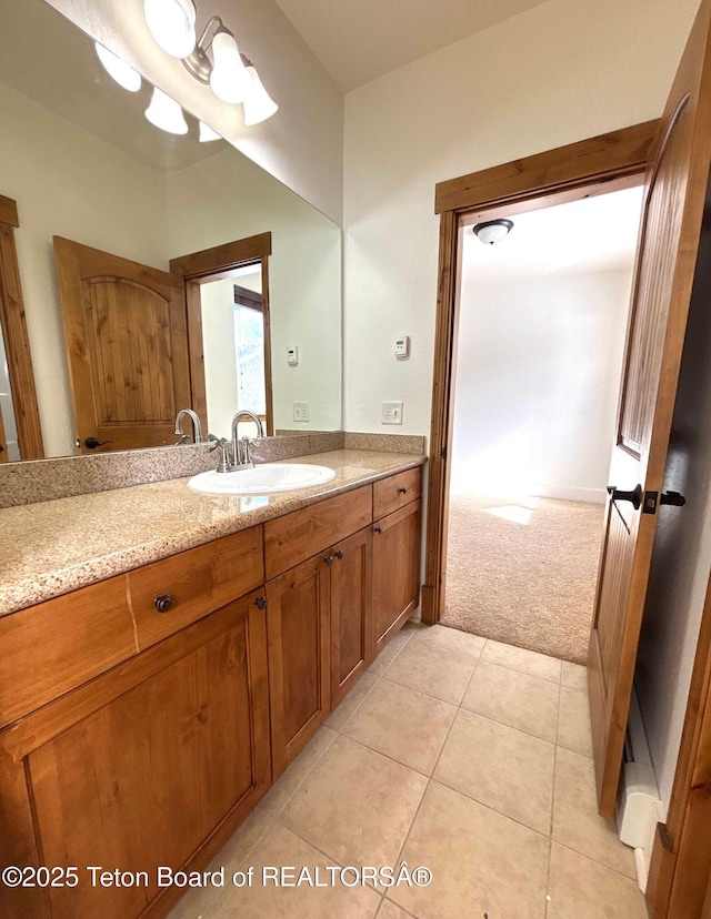 bathroom with tile patterned floors and vanity