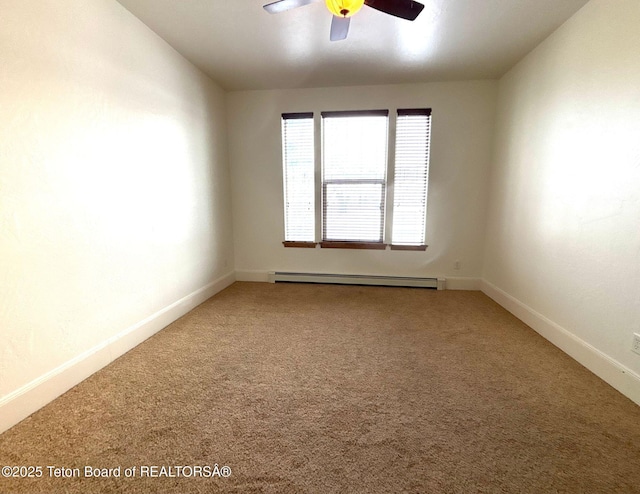 empty room with a ceiling fan, carpet, baseboards, and baseboard heating