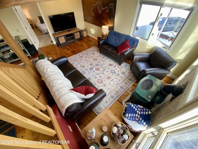 living room with baseboards and wood finished floors