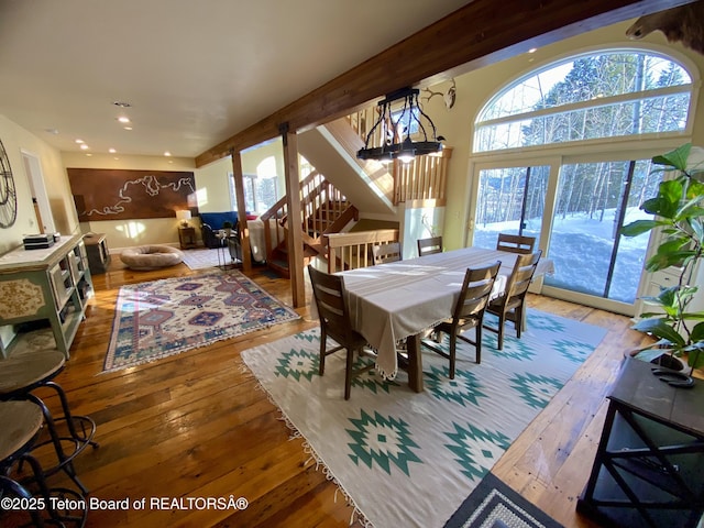 dining space featuring stairs, wood finished floors, and recessed lighting