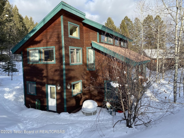 view of snow covered property