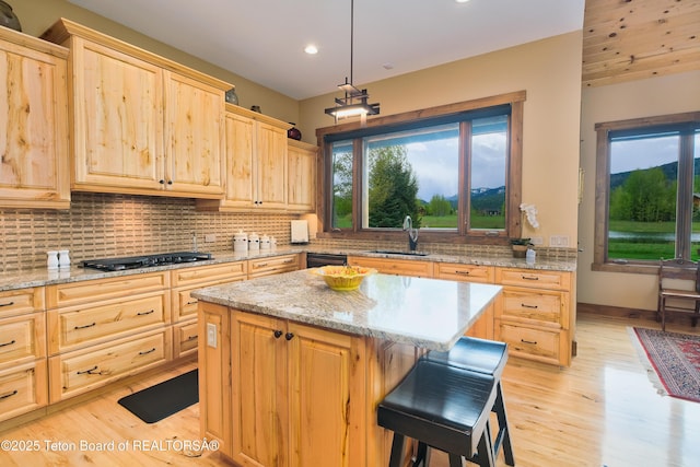 15 Kearsley Ln, Victor, ID 83455 - kitchen with light brown cabinetry, light wood-style floors, tasteful backsplash, and recessed lighting