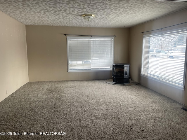 unfurnished room featuring carpet