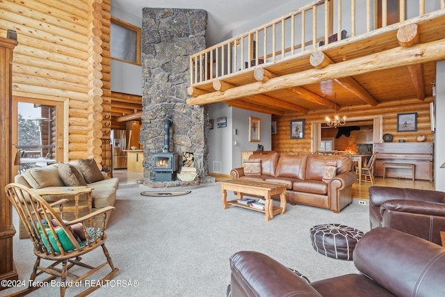 carpeted living area with rustic walls, beamed ceiling, a wood stove, a high ceiling, and a notable chandelier