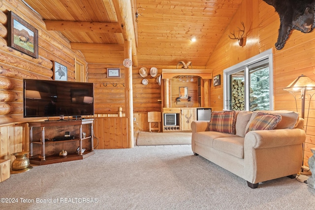 living area with lofted ceiling with beams, rustic walls, wood ceiling, and carpet flooring