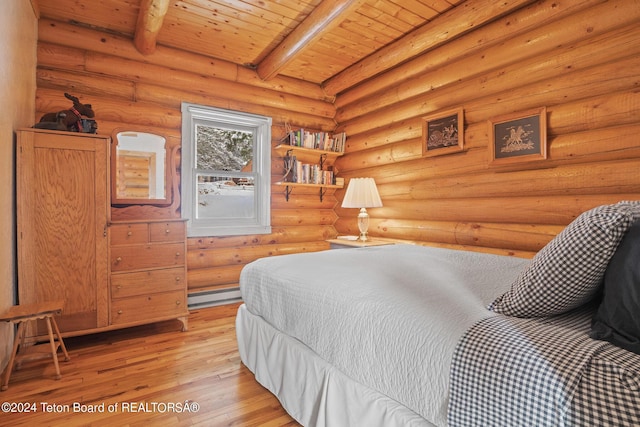 bedroom with wooden ceiling, a baseboard heating unit, light wood-style floors, beamed ceiling, and rustic walls