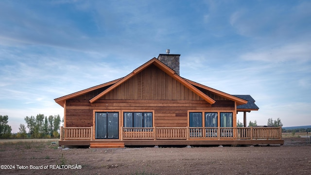 4660 Pale Morning Dr, Tetonia, ID 83452 - rear view of property featuring roof with shingles and a chimney