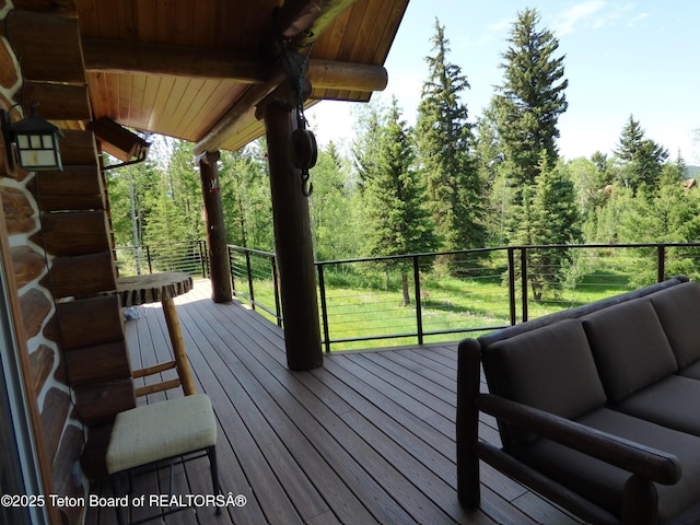 wooden deck featuring an outdoor hangout area