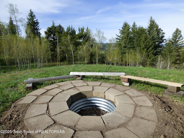 exterior space with a fire pit