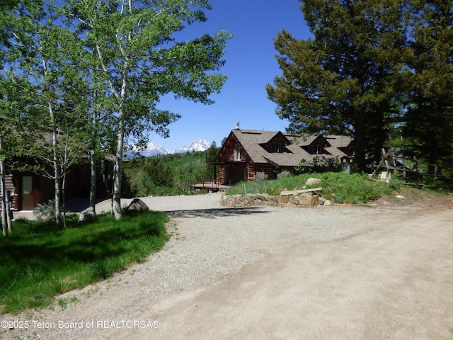 view of property exterior featuring dirt driveway