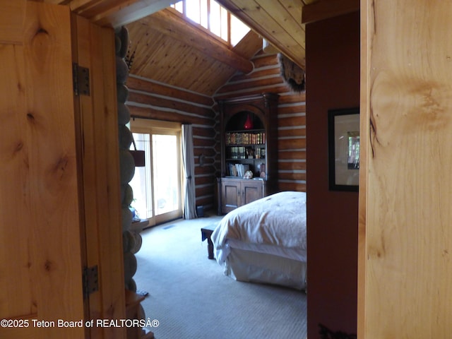 carpeted bedroom featuring lofted ceiling with beams and wooden ceiling