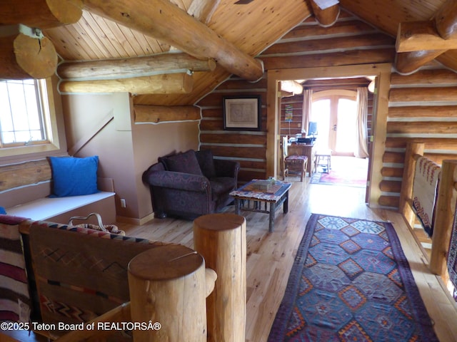 living room with lofted ceiling with beams, hardwood / wood-style flooring, and wood ceiling