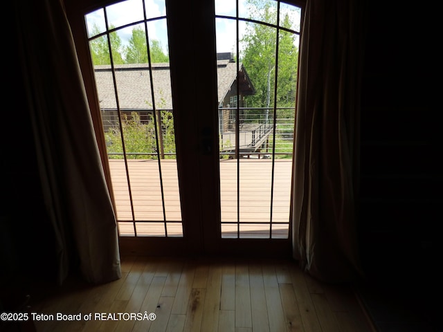 doorway featuring wood finished floors