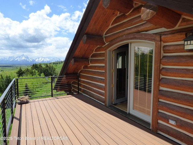 wooden deck featuring a mountain view