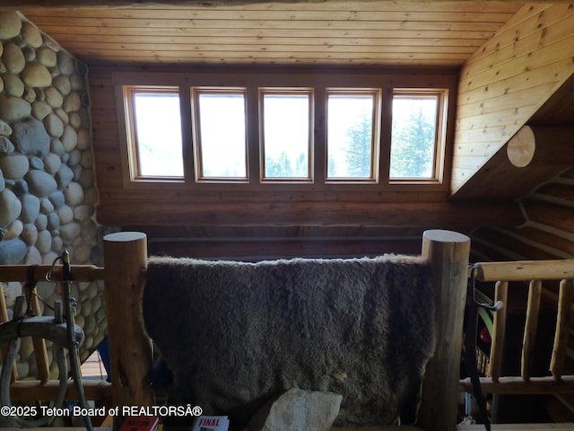 interior space featuring wood ceiling and a wealth of natural light