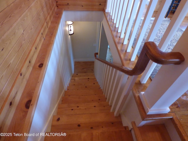 stairway featuring wood-type flooring