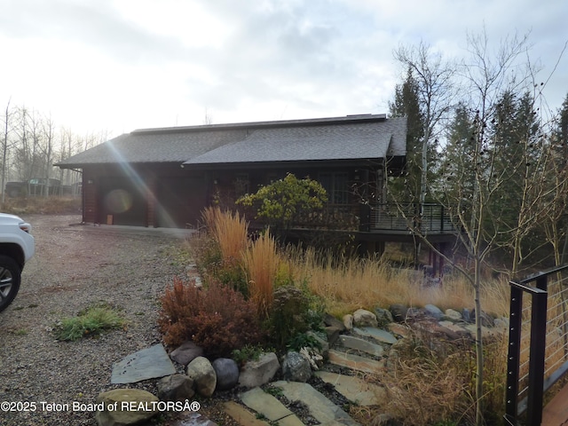 view of home's exterior featuring a shingled roof