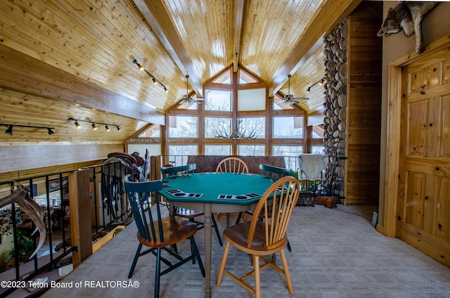 dining space featuring vaulted ceiling with beams, wooden ceiling, carpet flooring, and rail lighting