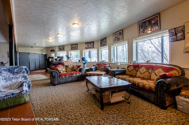 tiled living area featuring a textured ceiling