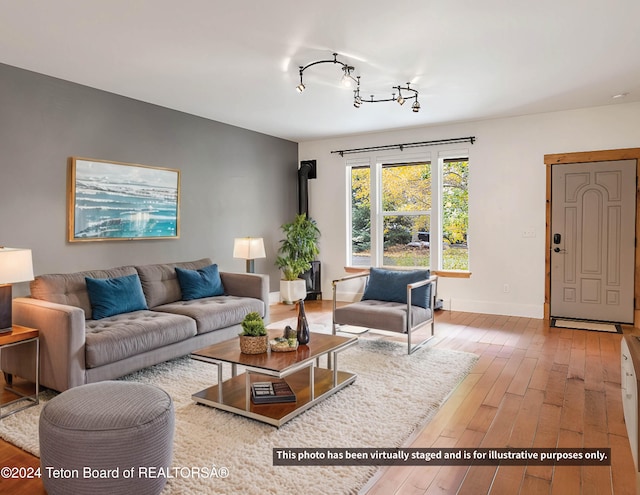 living room with wood-type flooring and baseboards