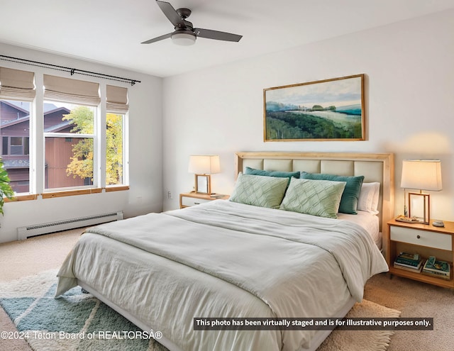 bedroom with carpet floors and a baseboard radiator