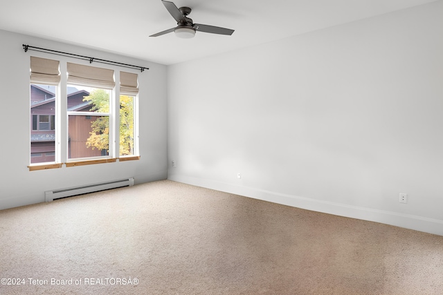 carpeted empty room with baseboards, ceiling fan, and baseboard heating